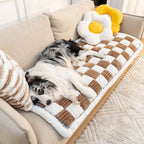 Chenille pet blanket with brown and white striped tiles and scalloped border