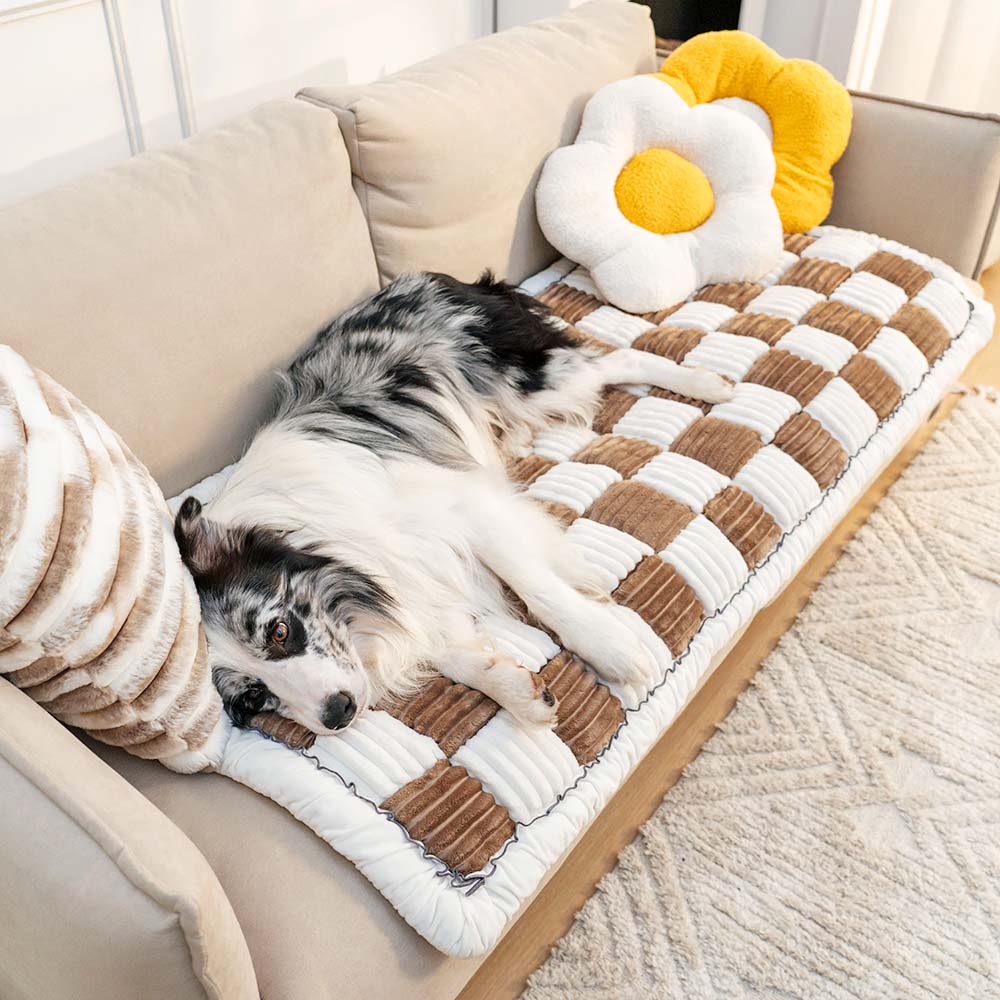 Chenille pet blanket with brown and white striped tiles and scalloped border