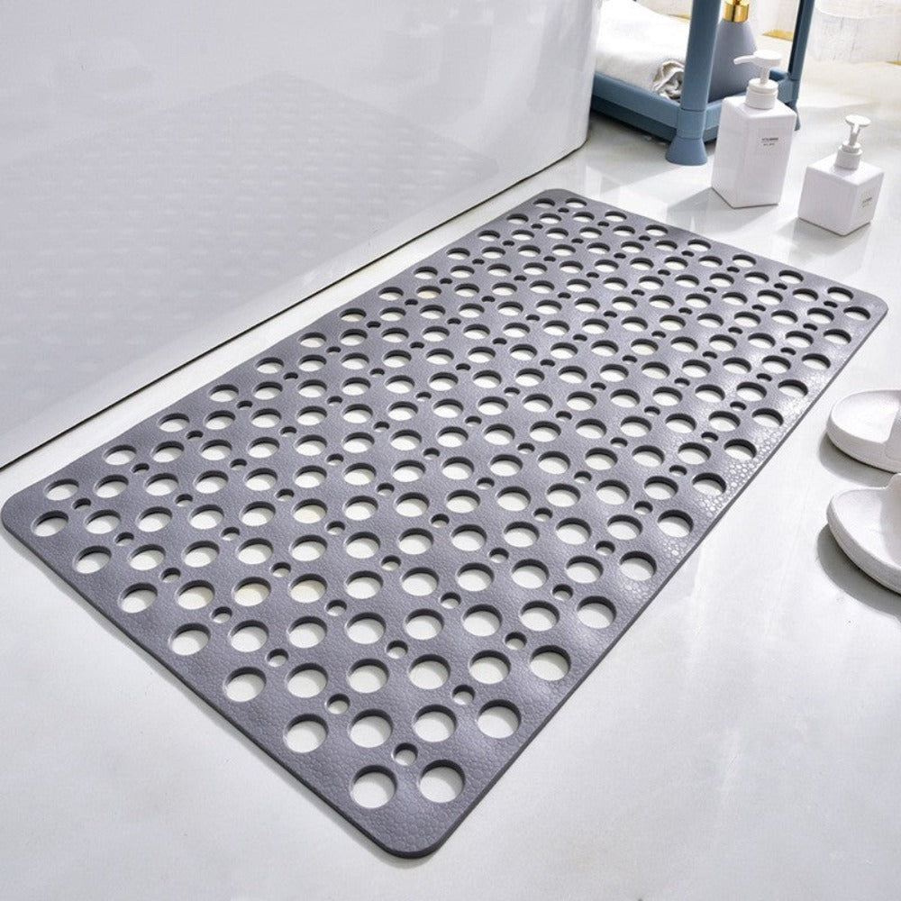 Gray perforated shower mat with non-slip backing for bathtub or shower floor.