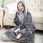 Oversized gray wearable blanket hoodie with hood and kangaroo pocket, sherpa-lined trim.