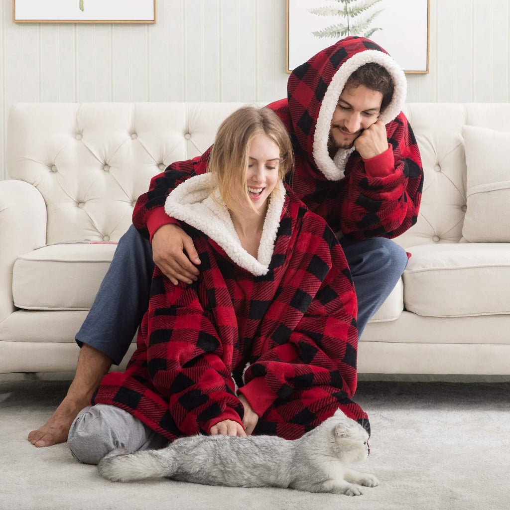 Red and black plaid oversized wearable blanket hoodie with hood and sherpa lining.