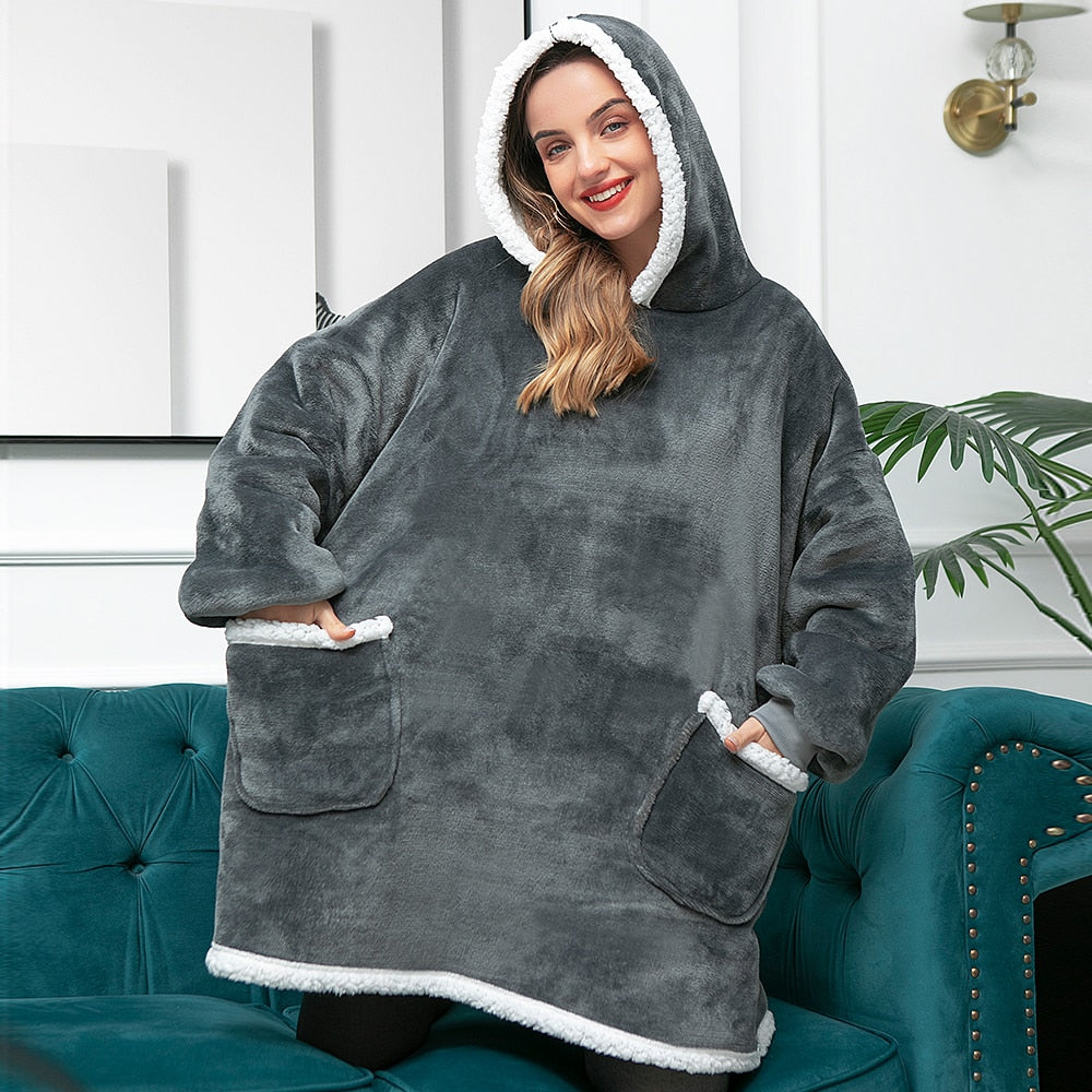 Oversized dark gray fleece wearable blanket hoodie with hood and kangaroo pocket, sherpa trim.
