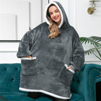 Oversized dark gray fleece wearable blanket hoodie with hood and kangaroo pocket, sherpa trim.