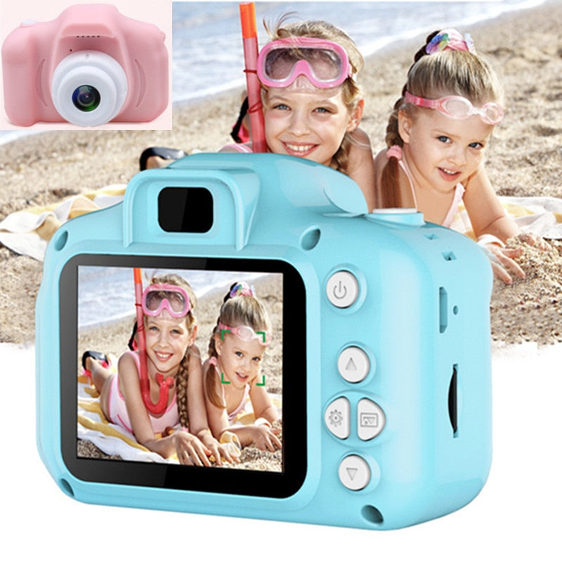 Blue kids digital camera with display showing photos while held by children outdoors