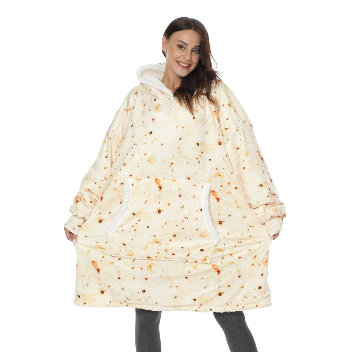 Cream oversized wearable blanket hoodie with speckled print, hood, and kangaroo pocket.
