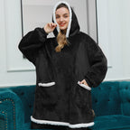 Black wearable blanket hoodie with hood and kangaroo pocket, white sherpa trim hem