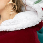 Red blanket hoodie with white sherpa hood lining and wide cozy cuff