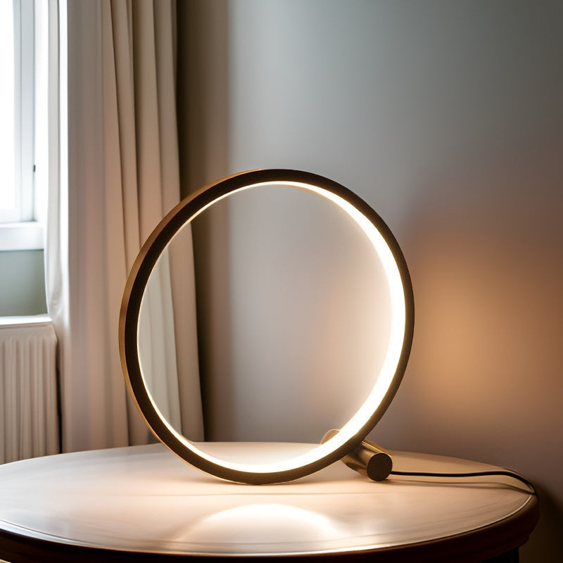 Minimalist round LED table lamp with touch control, glowing ring on tabletop, dark base