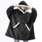 Black oversized wearable blanket hoodie with sherpa-lined hood and kangaroo pocket
