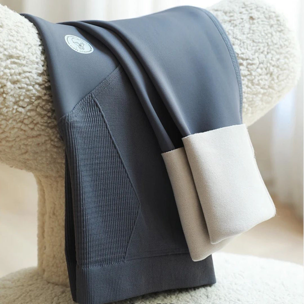 Blue-gray maternity leggings with ribbed front panel and smooth waistband, folded