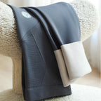 Blue-gray maternity leggings with ribbed front panel and smooth waistband, folded