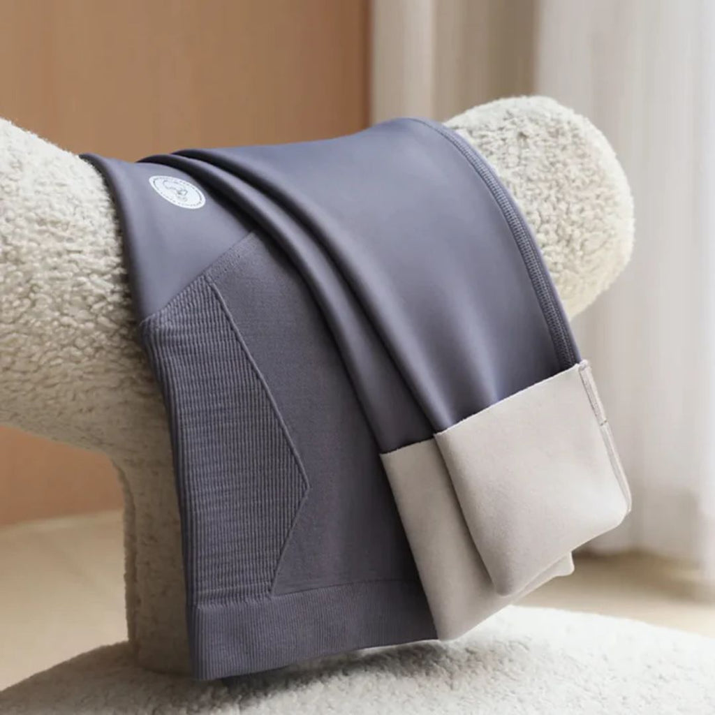 Slate blue maternity leggings with ribbed front panel and smooth waistband, folded