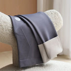 Slate blue maternity leggings with ribbed front panel and smooth waistband, folded