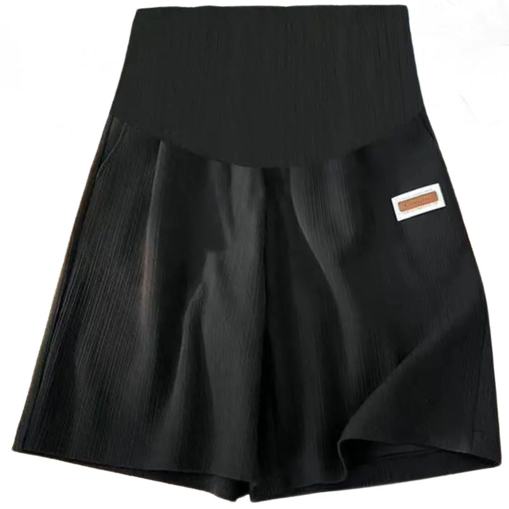 Seamless high-waist maternity bike shorts in black, with small side label