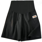 Seamless high-waist maternity bike shorts in black, with small side label
