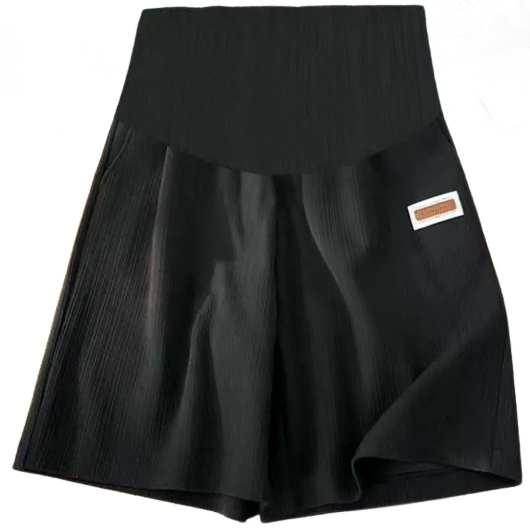 Seamless high-waist maternity bike shorts in black, with small side label