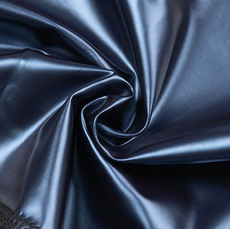 Shiny blue neoprene fabric panel with water-drop texture