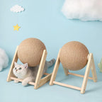 Cat scratching toy with two tan sisal balls on wooden frames, with cats exploring.