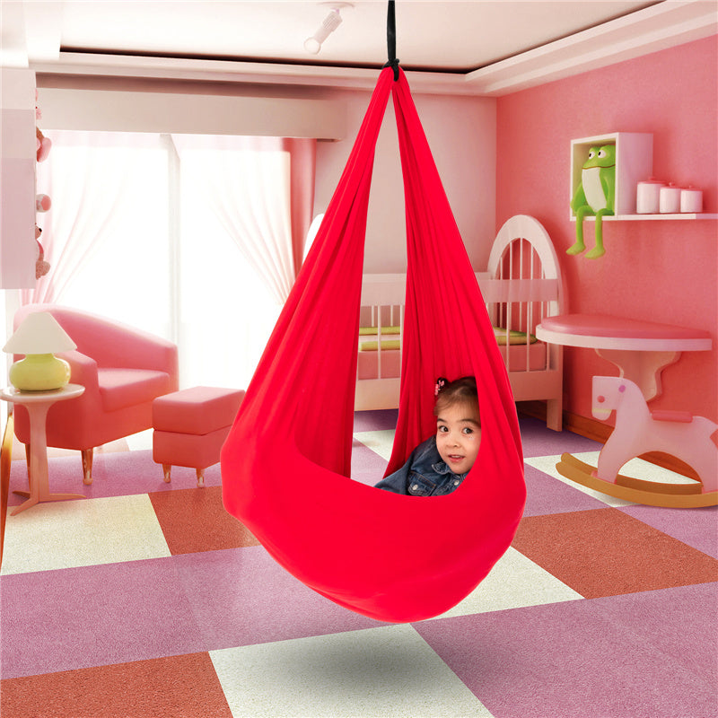 Red kids' cotton hammock swing cocoon hanging, child peeking from inside.