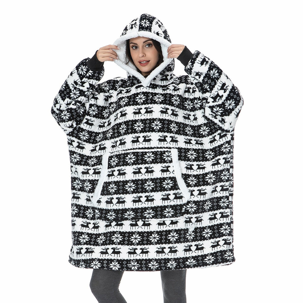 Black-and-white patterned oversized wearable blanket hoodie with hood and sherpa-style lining.