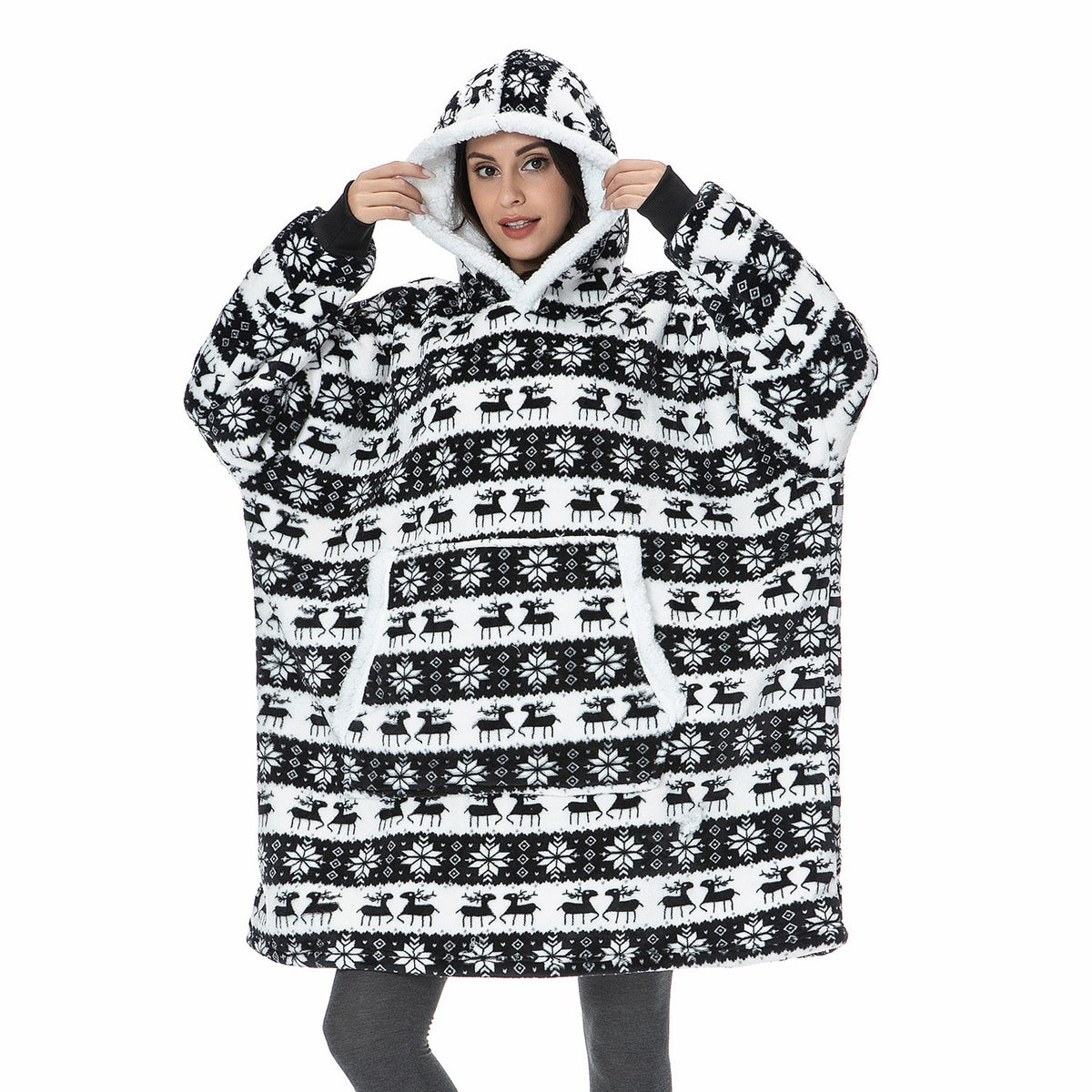 Black-and-white patterned oversized wearable blanket hoodie with hood and sherpa-style lining.