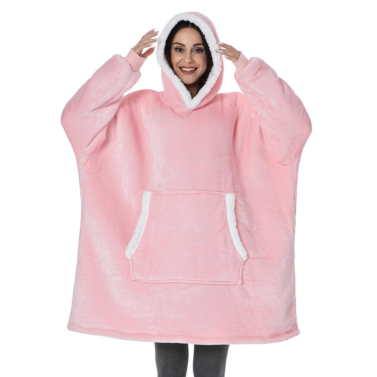 Blush pink oversized wearable blanket hoodie with hood and front kangaroo pocket.