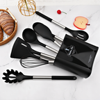 Black silicone kitchen utensil set with black canister, stainless handles, spatulas and whisk