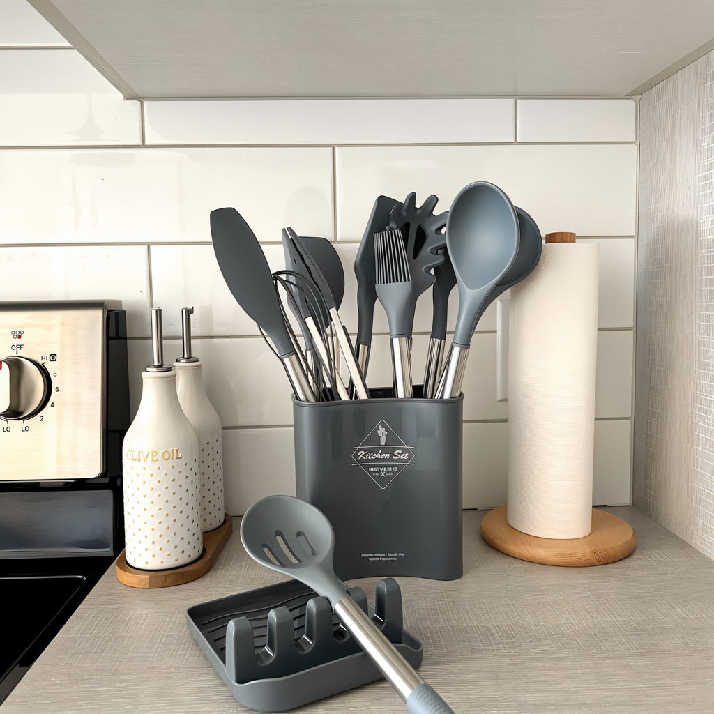 Gray silicone kitchen utensil set in a gray holder with stainless steel handles