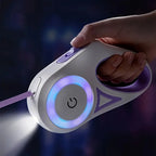 Hand holding purple LED light-up dog leash flashlight with glowing ring and power button
