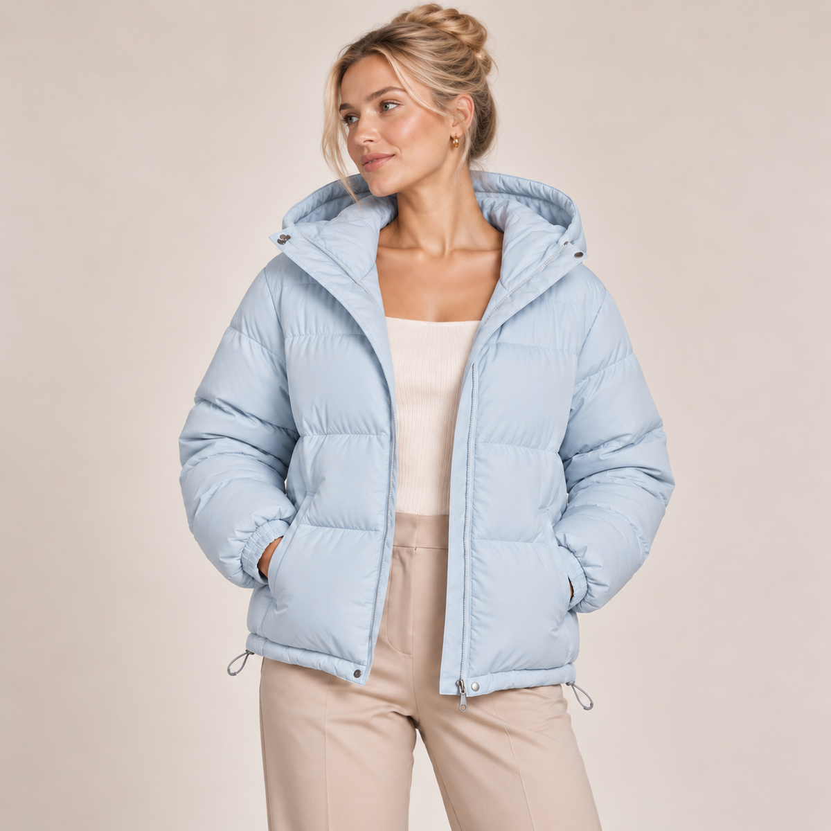 Women's light blue hooded puffer jacket, full-zip front, quilted insulated shell