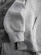 Women's grey hoodie sleeve and ribbed cuff detail, long sleeves