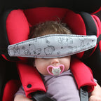 Child car seat headrest with white dinosaur pattern and adjustable cover for a child’s sleep