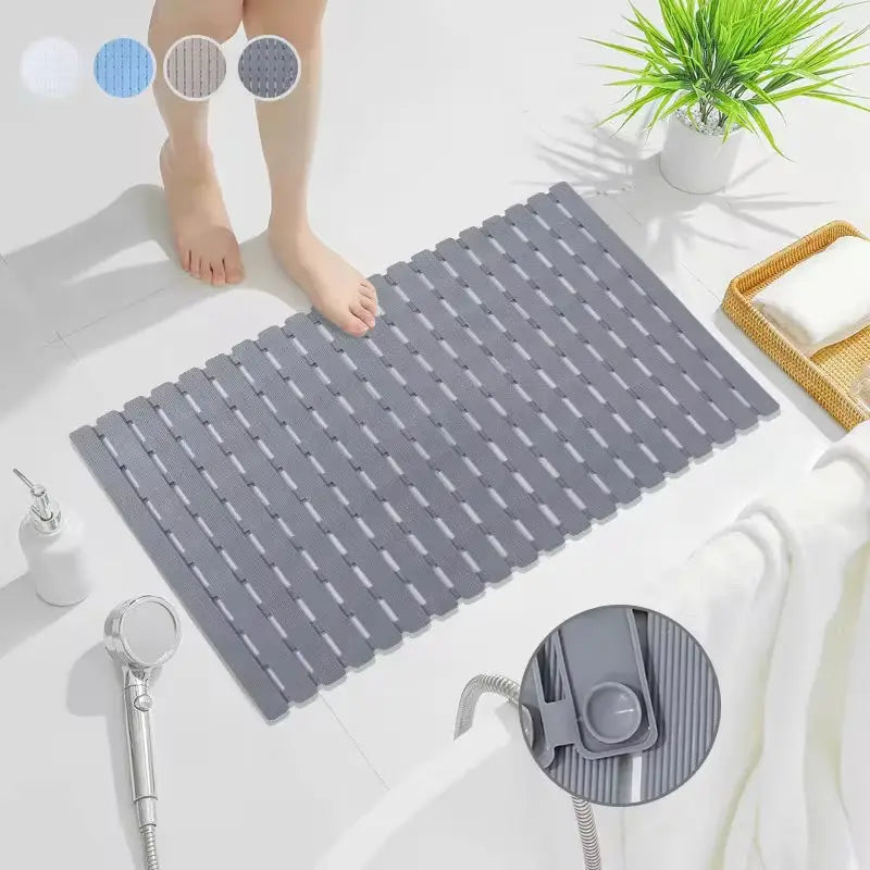 Gray bath mat with suction cup underside and drainage holes, ridged TPE surface