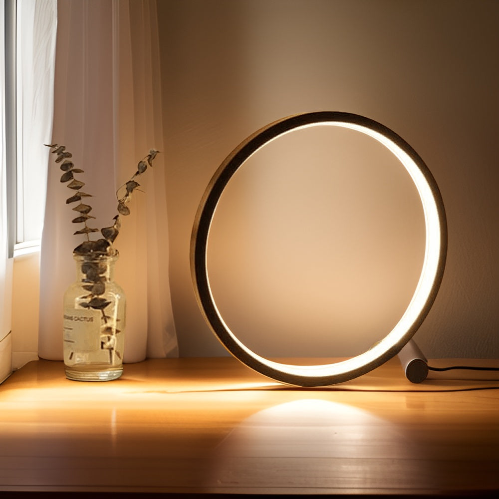 Minimalist round LED table lamp with touch control, glowing circular ring, dark stand