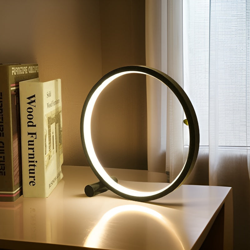 Minimalist round LED table lamp with touch control, glowing circular frame, dark base