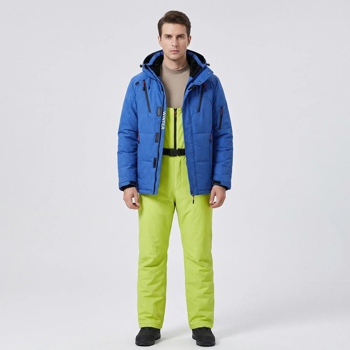 Padded ski jacket and snow pants set with blue jacket and neon green pants, hooded.