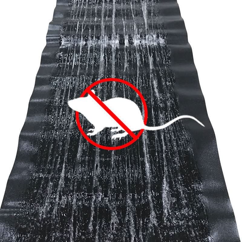 Black sticky mouse glue trap mat with crossed-out mouse icon over adhesive surface