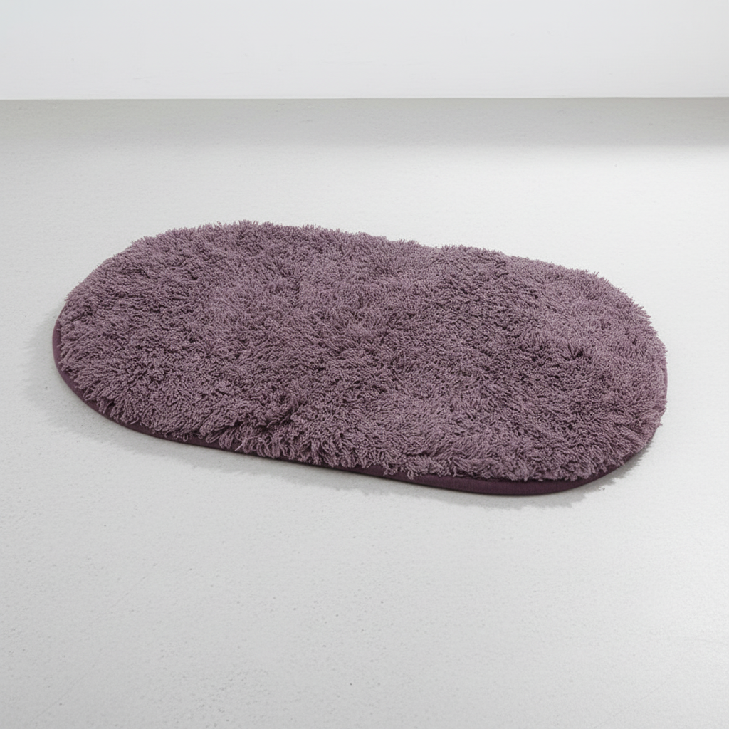 Purple oval microfiber non-slip bath mat with soft shaggy textured surface