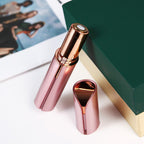 Rose gold and pink facial hair trimmer with circular grooming head and protective cap