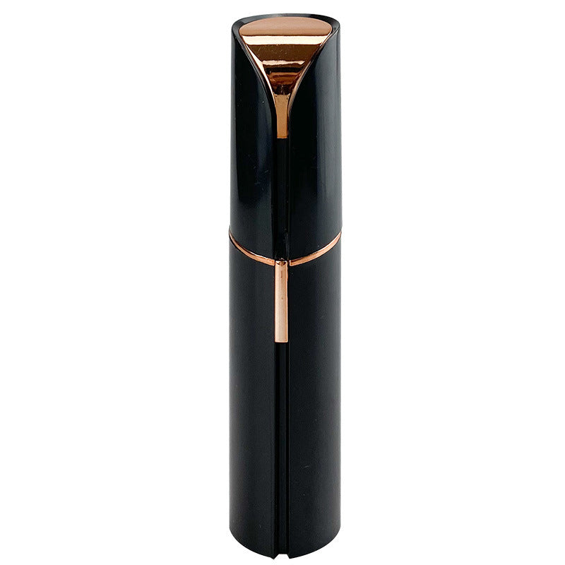 Black facial hair remover with gold-tone top and side ventilation slots