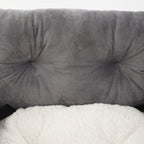 Gray booster bed cushion with tufted bolsters and fluffy white inner lining