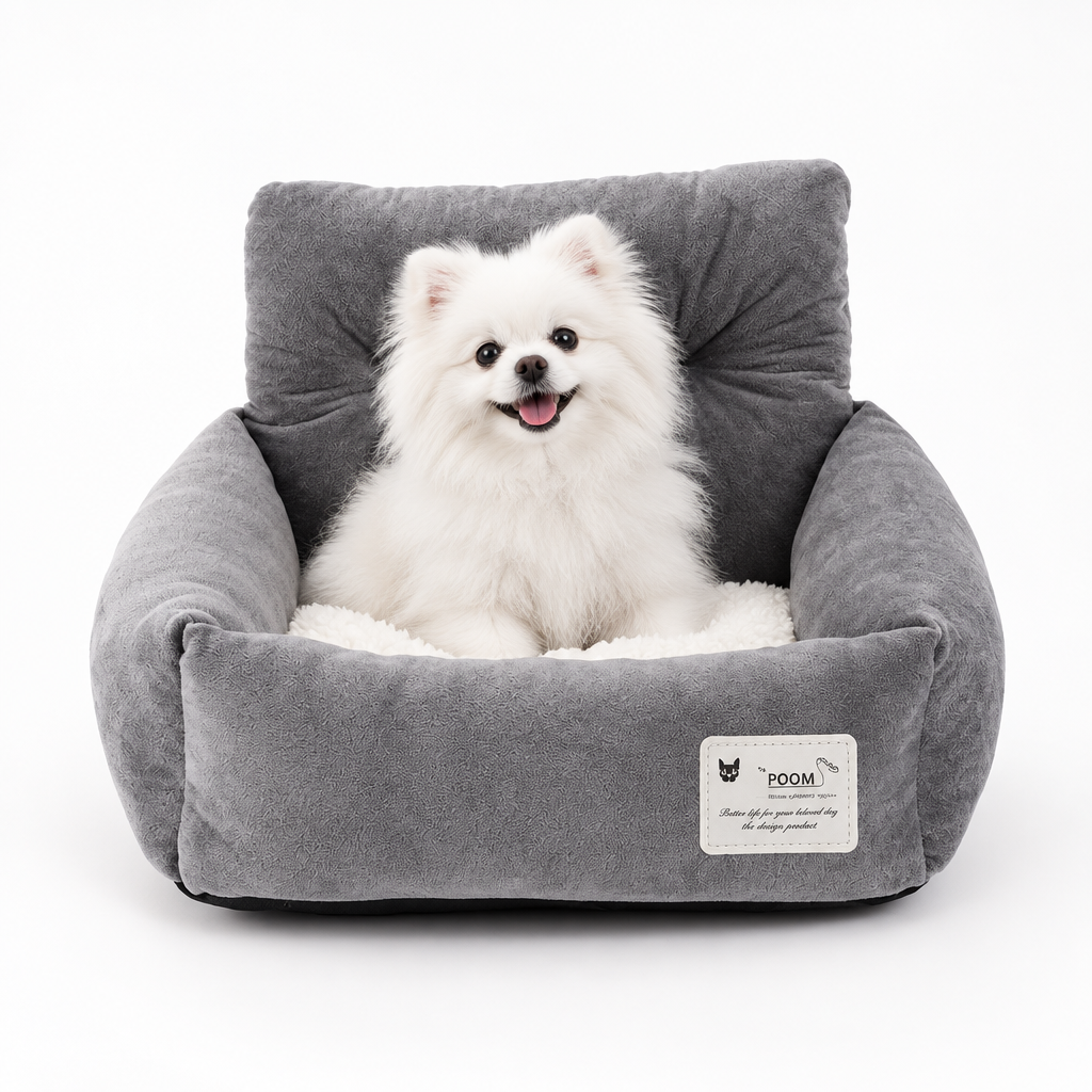 Gray soft dog booster bed with plush lining and small white dog sitting inside