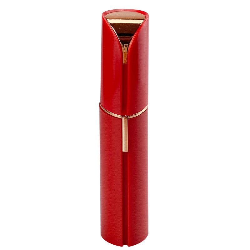 Red facial hair remover with gold-tone top and centered grooming handle
