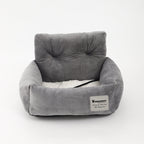 Gray dog booster bed with raised backrest, plush lining, and black strap