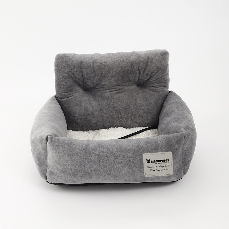 Gray dog booster bed with raised backrest, plush lining, and black strap