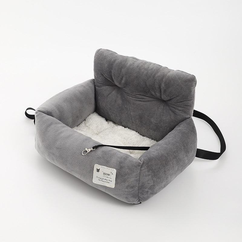Gray plush dog booster bed with side handle strap and cushioned rim