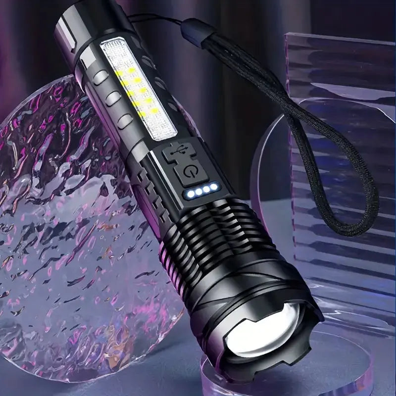 Close-up of black flashlight with bright LED panel and side button