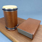 Rolling knife sharpener with brown cylinder, diamond disc, and 15° guide block