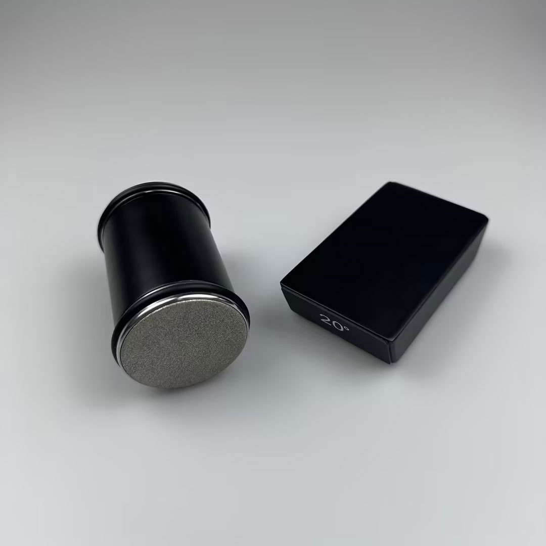 Rolling knife sharpener with black handle, textured diamond disc, and 20° guide block