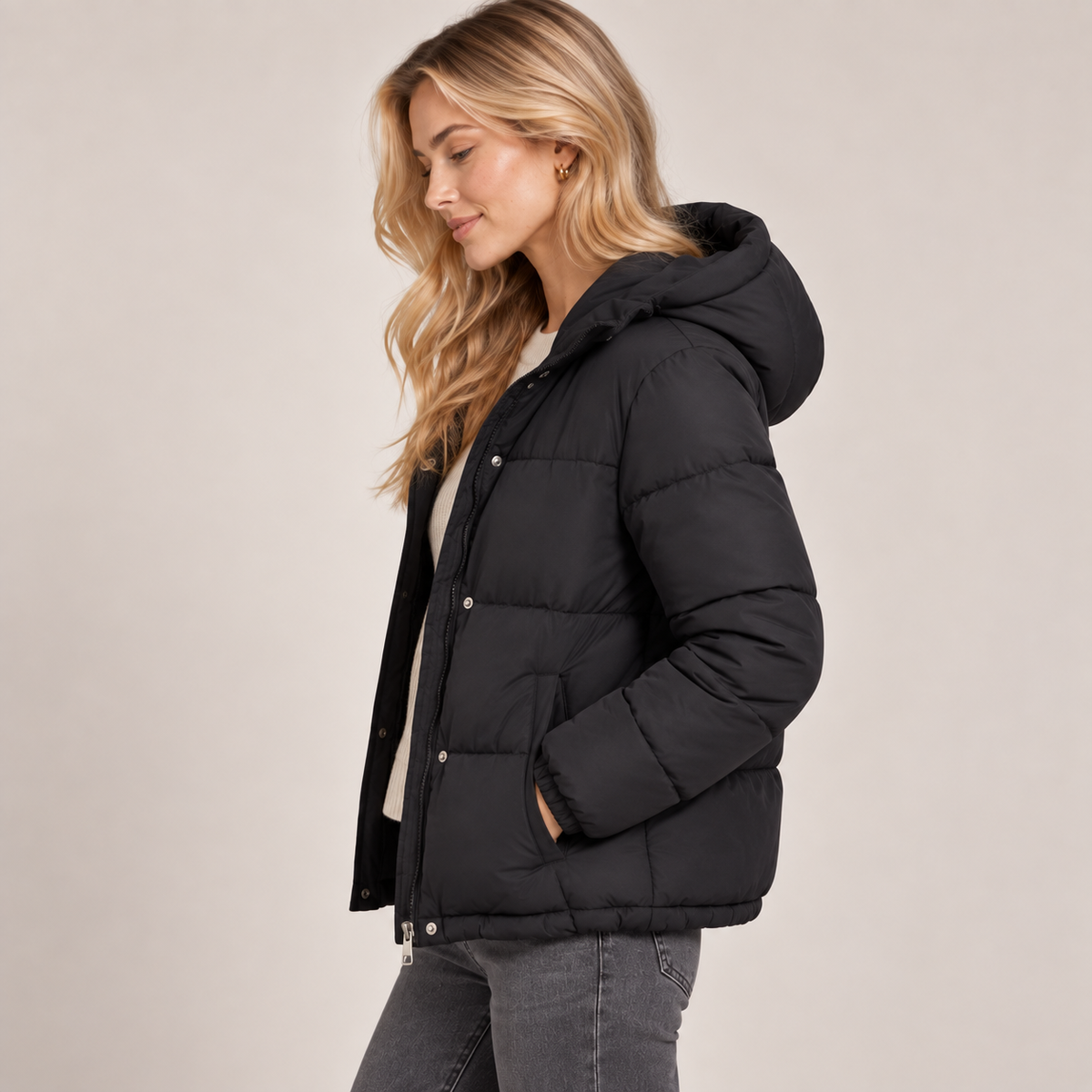 Women's black quilted puffer jacket with hood, zip-front and side pockets
